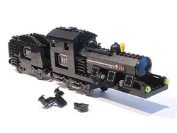 Black large steam locomotive head and coal car.
